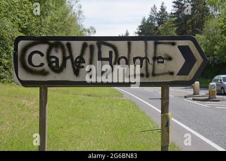 "Covid Lies" spray painted on a road sign to a care home in Ironbridge, near Telford UK, by Covid deniers, June 2021 Stock Photo