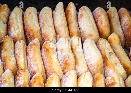 Rows of ciabattas on display at Broadway Market, a street market in Hackney, East London Stock Photo