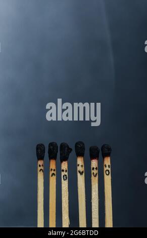 Group of a red match burning isolated with the background. Row burning matchstick in the chain reaction. Matchstick art photography. Stock Photo
