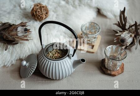 Close-up of a teapot in a Scandinavian style with tea. Stock Photo