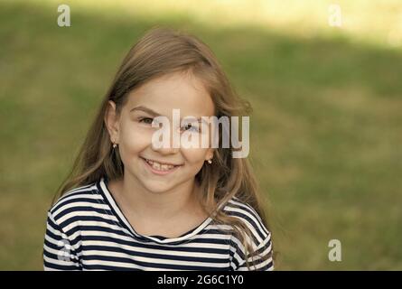 Smile that makes lasting impression. Happy child smile summer outdoors. Dental health. Oral hygiene. Cavities and teeth decay prevention. Dental Stock Photo