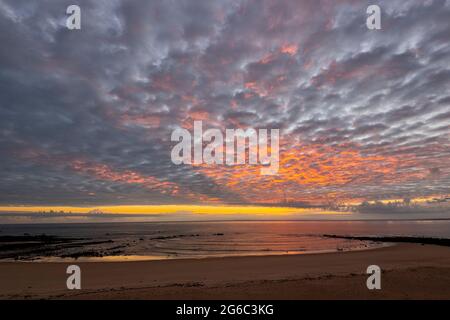 Spectacular sunrise with mackerel sky over Pender Bay Escape, Dampier Peninsula, Western Australia Stock Photo