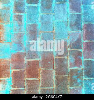 A turquoise-blue wall made of concrete blocks. Background, texture. Stock Photo