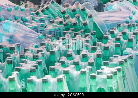 Plastic bottles of water wrapped in plastic membrane Stock Photo