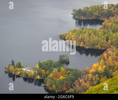 Autumnal Trees on the side of Derwent Water near Keswick, Cumbria. Stock Photo