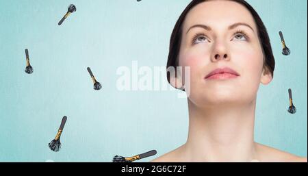 Composition of make up brush with woman repeated on white background Stock Photo