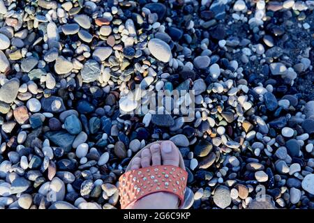 Pebbles texture and feminine step. Summer wallpaper or print. Seamless pattern. High quality photo Stock Photo