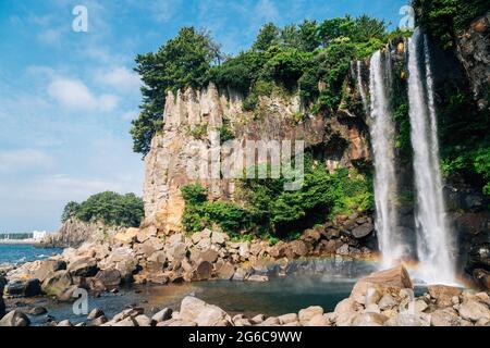 Jeongbang Falls and sea in Jeju Island, Korea Stock Photo