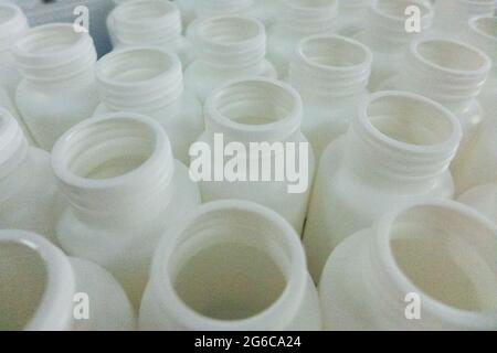 Empty white medical plastic bottles for production Stock Photo