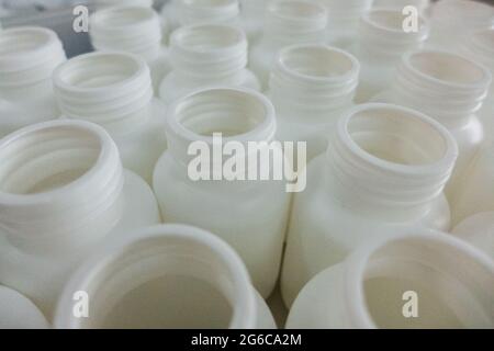 Empty white medical plastic bottles for production Stock Photo