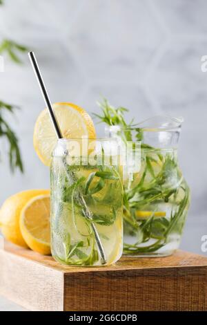 Refreshing homemade lemonade with tarragon and lemon. Summer drinks. Stock Photo