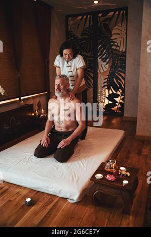 Grizzled man is coming for thai massage Stock Photo