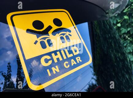 Close-up view of Child in car sticker on the car back windows. Stock Photo