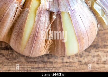 Macro of garlic cloves over wood background Stock Photo