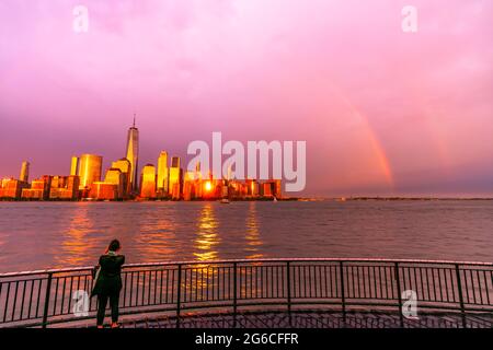 Rainbow Appears Over The Lower Manhattan Skyscraper NYC. Stock Photo