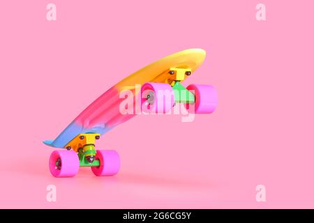 rainbow plastic Penny board skateboard isolated on pink background Stock Photo