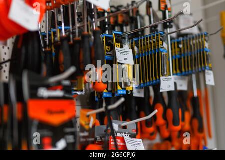 Grodno, Belarus - June 20, 2018: Hand hold Graff drill bits and screwdriver set in the building materials store Alkor Stock Photo