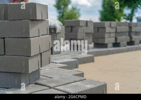 Close-up new paving slabs in rows in summer close-up, copy the space. Laying of paving slabs Stock Photo
