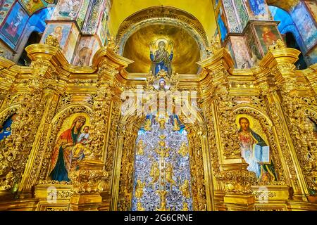 KYIV, UKRAINE - MAY 18, 2021: The fine carved patterns of the stunning golden iconostasis of St Sophia Cathedral, on May 18 in Kyiv Stock Photo