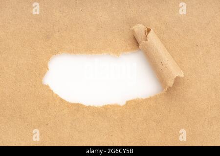 Blank White Space In Brown Torn Paper. Mock up Stock Photo