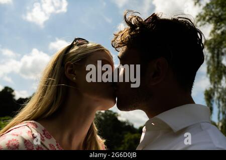 Love story of indian couple posed outdoor, man kiss her hand. 10491929  Stock Photo at Vecteezy