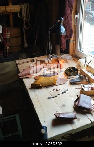 Image of workplace of shoemaker with tools on it preparing for work Stock Photo