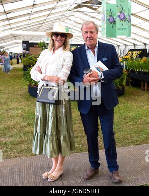 London, UK. 5th July, 2021. Jeremy Clarkson and his girlfriend, Lisa Hogan. Press preview of the RHS Hampton Court Palace Garden Festival which runs from July 6th-July 11th. Credit: Mark Thomas/Alamy Live News Stock Photo