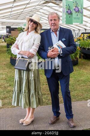 London, UK. 5th July, 2021. Jeremy Clarkson and his girlfriend, Lisa Hogan. Press preview of the RHS Hampton Court Palace Garden Festival which runs from July 6th-July 11th. Credit: Mark Thomas/Alamy Live News Stock Photo