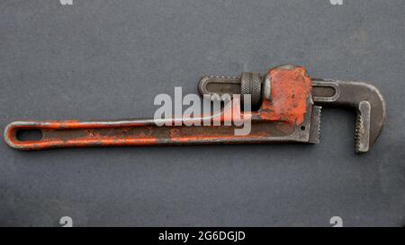 A Pipe Wrench on a Black Background Stock Photo