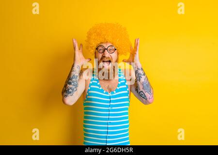 man with yellow beard,wig and glasses Stock Photo