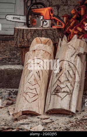 Wood sculpture. Souvenir made of wood in a rustic outside background. Stock Photo