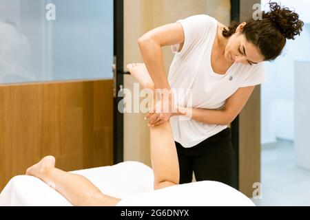 Middle-aged woman having a back massage in a beauty salon. 4675724