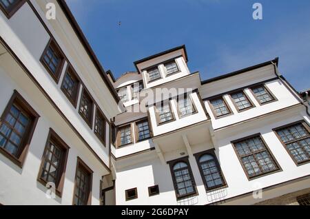Abandoned white old house vintage style with wooden windows on clear blue sky Stock Photo