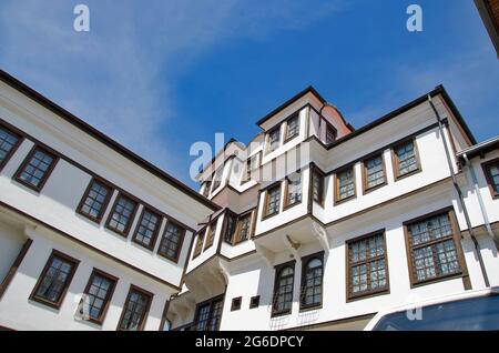 Abandoned white old house vintage style with wooden windows on clear blue sky Stock Photo