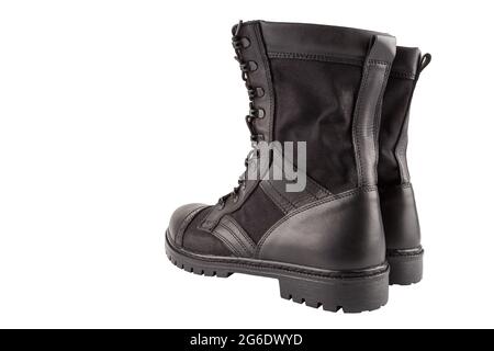 a pair of one new black lightweight military boots isolated on white background, standing vertically, view from back. Stock Photo