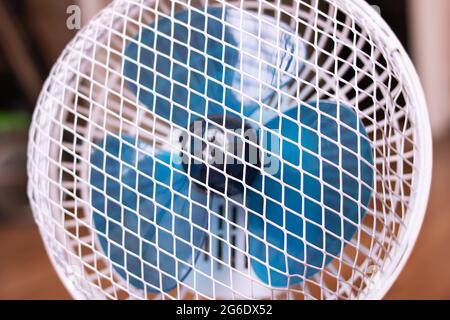 Small indoor fan on the background of the room Stock Photo