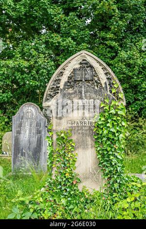 Gravestones in churchyard of Holy Trinity church, Morecambe, Lancashire Stock Photo