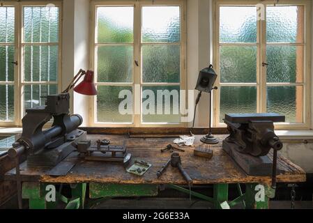 Workbench with vice in a workshop for car valves, Industrial Museum, Lauf an der Pegnitz, Middle Franconia, Bavaria, Germany Stock Photo