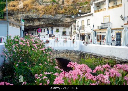 White washed houses built under the rock in Setenil de las Bodegas, Andalucia, Spain Stock Photo