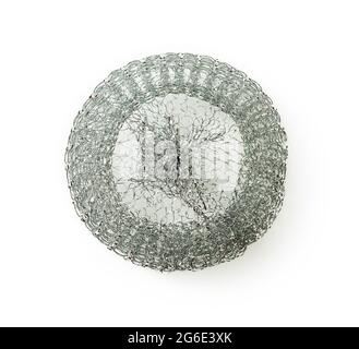 New stainless steel sponge for pans isolated on white background. Kitchen wire scrubber for cleaning pots and dishes. Metal kitchen sponge close-up. Stock Photo