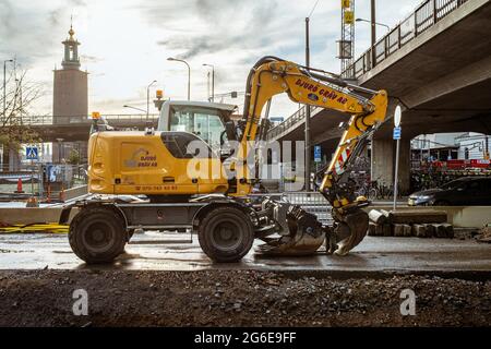 Excavator in Stockholm, Vasagatan, Stockholm, Sweden Stock Photo