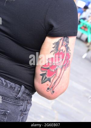 Tattoo of a woman on the arm of a woman  in Manchester, England, United Kingdom Stock Photo