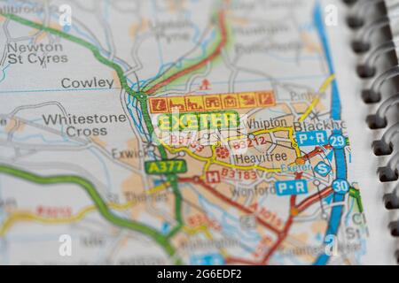 A macro closeup of a page in a printed road map atlas showing the city of Exeter in England Stock Photo