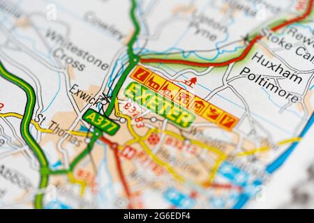 A macro closeup of a page in a printed road map atlas showing the city of Exeter in England Stock Photo