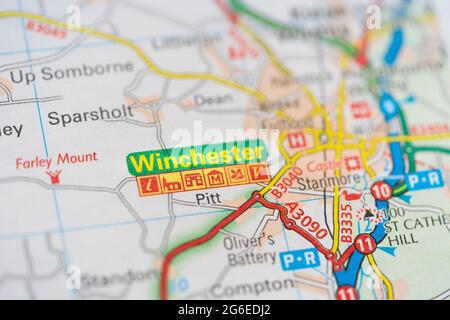 A macro closeup of a page in a printed road map atlas showing the city of Winchester in the county of Hampshire, England Stock Photo