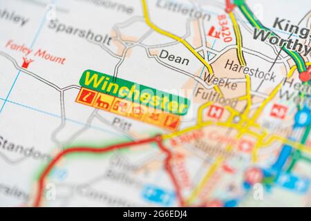 A macro closeup of a page in a printed road map atlas showing the city of Winchester in the county of Hampshire, England Stock Photo