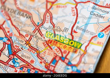 A macro closeup of a page in a printed road map atlas showing the  Scottish city of Glasgow Stock Photo