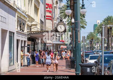 NEW ORLEANS, LA, USA - MAY 22, 2021: Shops and shoppers on Canal Street Stock Photo