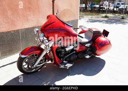 Umea, Norrland Sweden - June 5, 2021: a beautiful red motorcycle parked Stock Photo