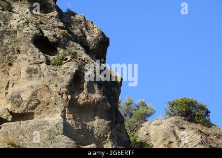 Closeup of rock outcrop in Andalusia resembling face of an Ape Stock Photo